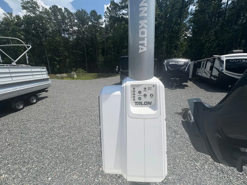 Slide: The Image of Minn Kota Talon anchor system on Parker 2300 Special Edition, 2021, in a gravel lot. - 13