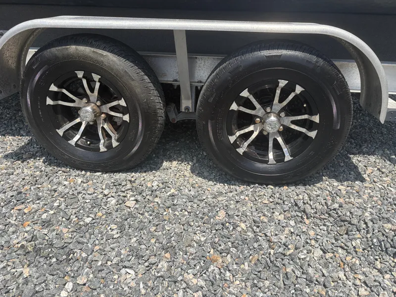 Slide: The Image of Trailer wheels of a 2021 Parker 2300 Special Edition on gravel surface. - 3