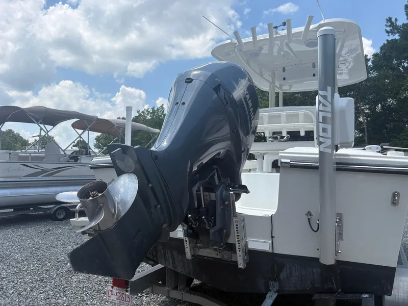 Slide: The Image of 2021 Parker 2300 Special Edition boat with Yamaha outboard motor, parked on gravel lot. - 7