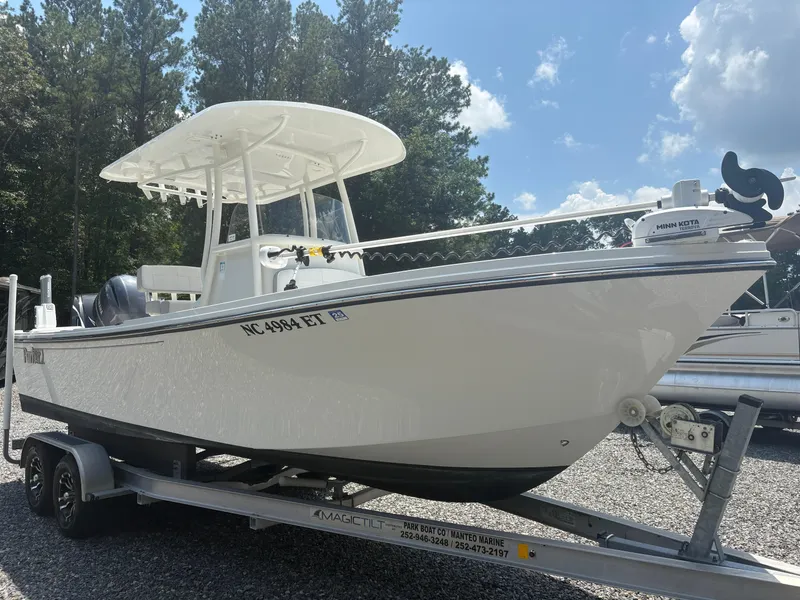 Slide: The Image of 2021 Parker 2300 Special Edition boat on trailer, parked outdoors under a clear sky. - 9