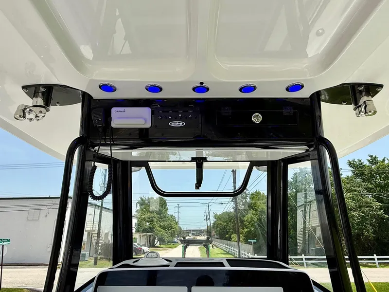 Slide: The Image of 2026 Sea Hunt Gamefish 28 Coffin Box helm with electronics and blue LED lights. - 12