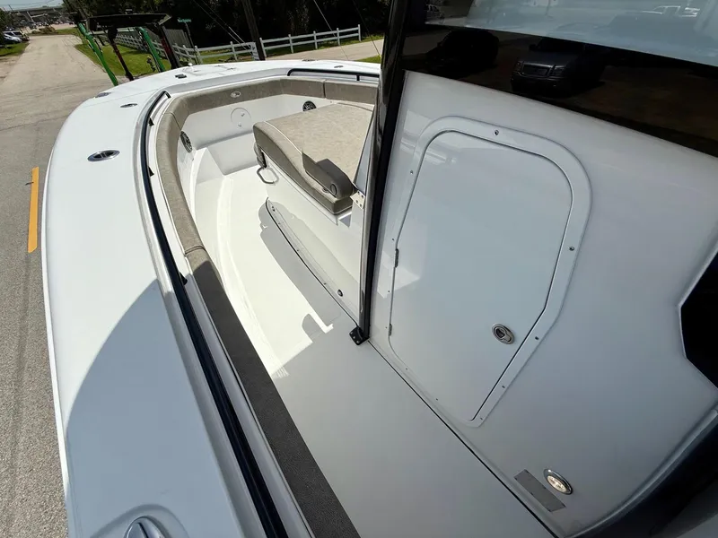 Slide: The Image of 2026 Sea Hunt Gamefish 28 Coffin Box boat interior with seating and storage. - 14