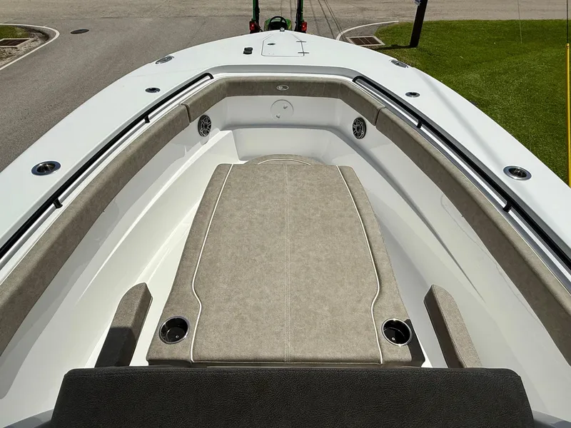 Slide: The Image of 2026 Sea Hunt Gamefish 28 Coffin Box boat interior with cushioned seating and cup holders. - 16