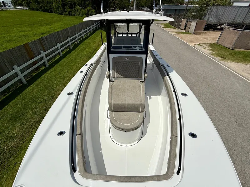 Slide: The Image of 2026 Sea Hunt Gamefish 28 Coffin Box boat, spacious deck, sleek design, white exterior. - 18