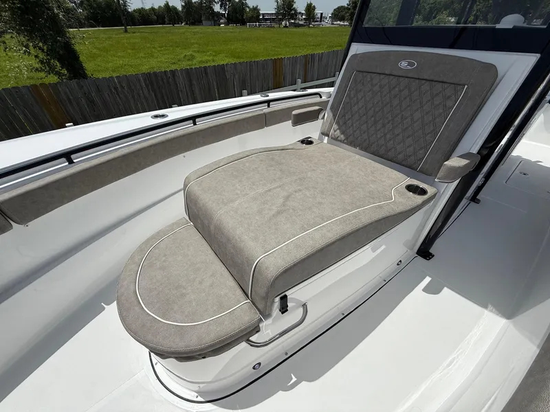 Slide: The Image of 2026 Sea Hunt Gamefish 28 Coffin Box with cushioned seating, outdoor setting. - 22