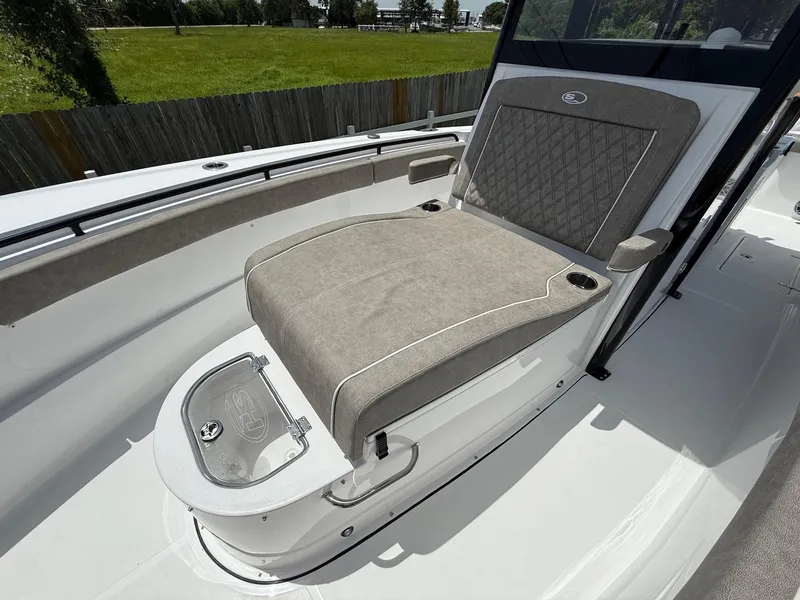 Slide: The Image of 2026 Sea Hunt Gamefish 28 Coffin Box with cushioned seating and storage. - 23