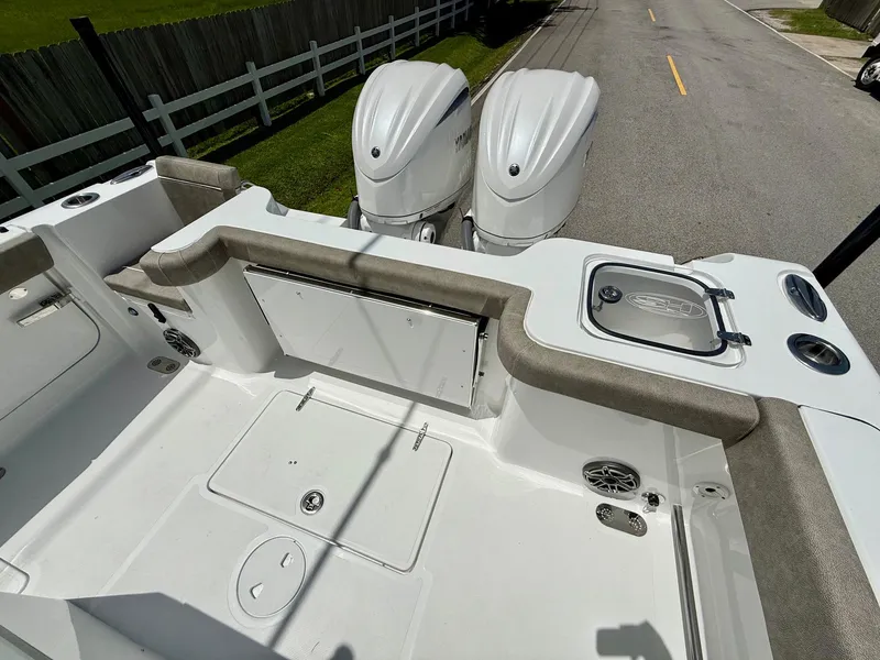 Slide: The Image of 2026 Sea Hunt Gamefish 28 Coffin Box boat with dual engines and spacious deck. - 8