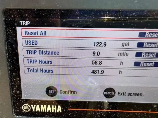 Slide: The Image of Yamaha trip display showing fuel usage and trip statistics for NauticStar 2302 Legacy Dual Console. - 14