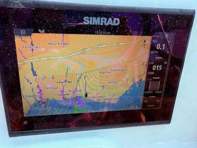 Slide: The Image of Simrad navigation display on 2020 NauticStar 2302 Legacy Dual Console boat. - 17