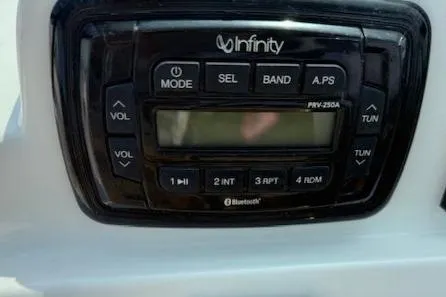 Slide: The Image of Infinity stereo system on 2020 NauticStar 2302 Legacy Dual Console boat. - 22