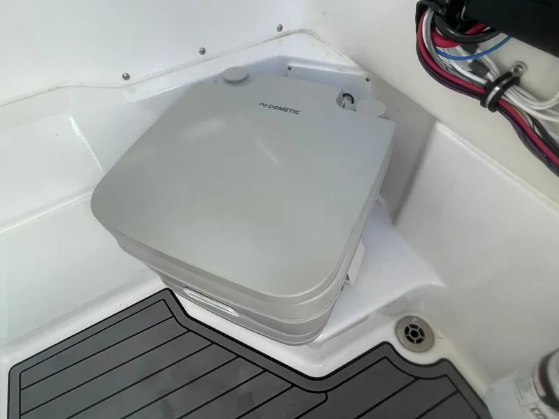 Slide: The Image of Portable toilet on 2023 Everglades 235 Center Console boat, featuring compact design and modern fittings. - 20
