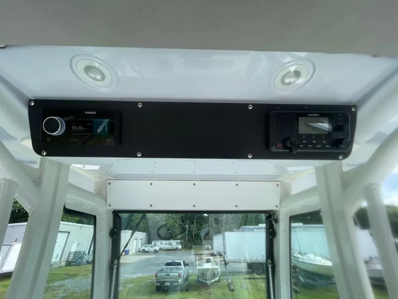 Slide: The Image of 2023 Everglades 235 Center Console interior with Fusion and Garmin electronics. - 27