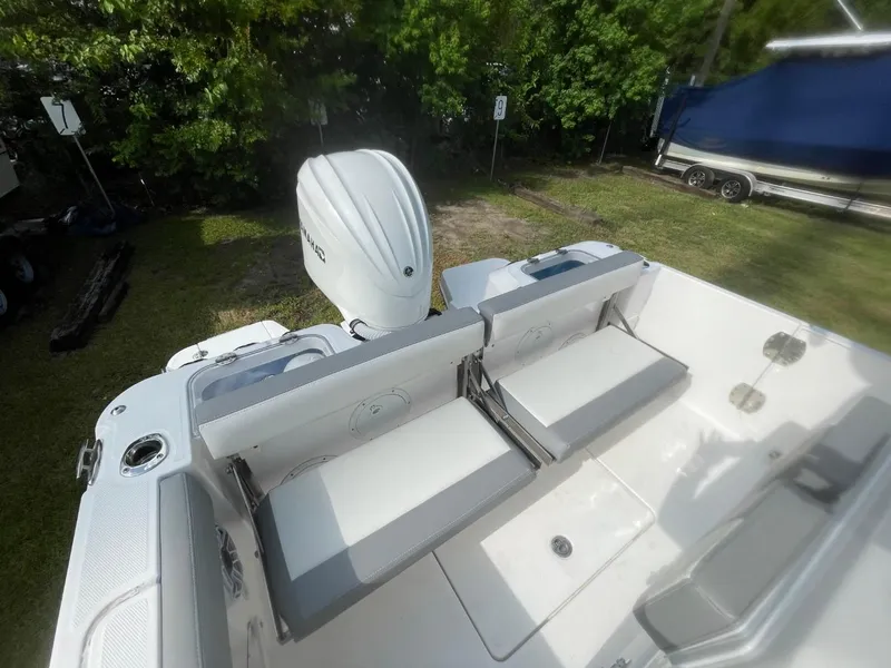 Slide: The Image of 2023 Everglades 235 Center Console boat with Yamaha outboard engine, featuring foldable seating. - 30