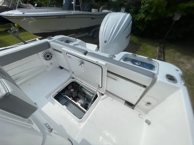 Slide: The Image of 2023 Everglades 235 Center Console boat interior with open storage compartment. - 31