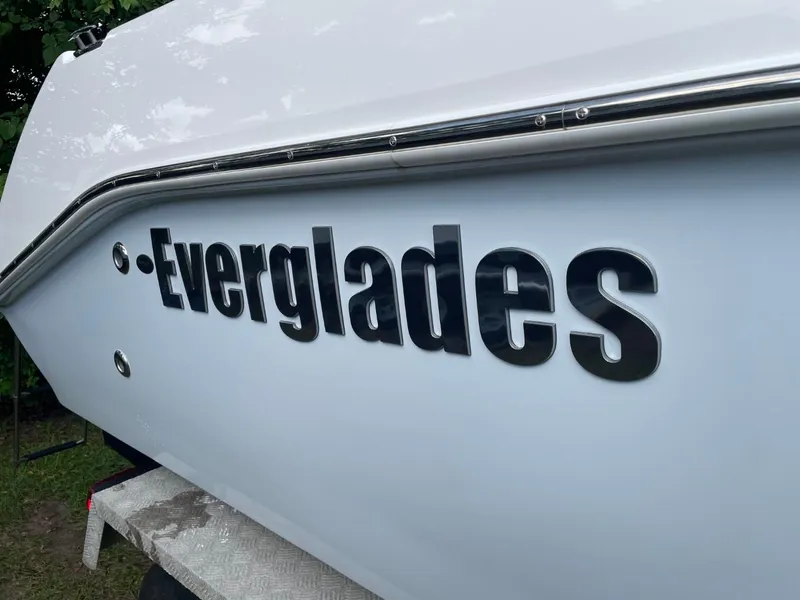 Slide: The Image of 2023 Everglades 235 Center Console boat side view with logo. - 9