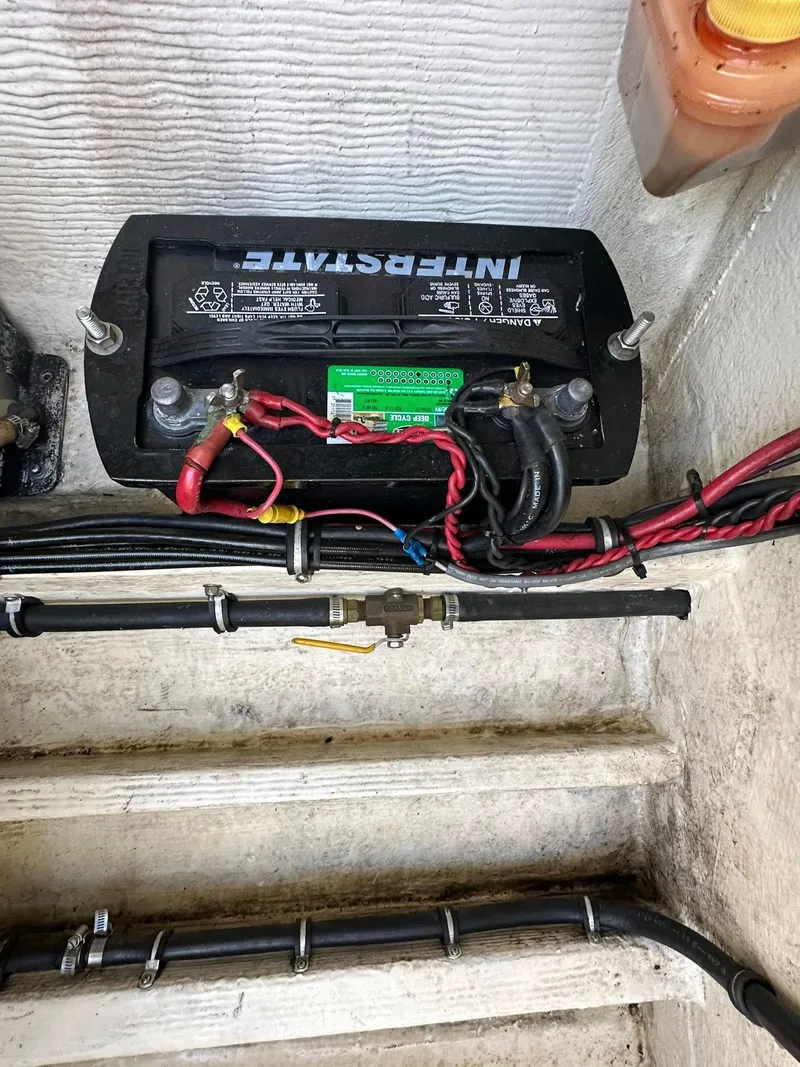 Slide: The Image of Battery setup in a 1994 Fountain 35 Lightning boat, featuring Interstate battery and wiring. - 27