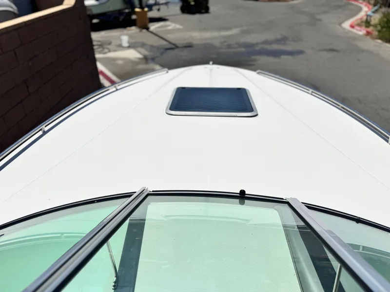 Slide: The Image of 2004 Chaparral 265 SSi boat deck view with windshield and hatch. - 8