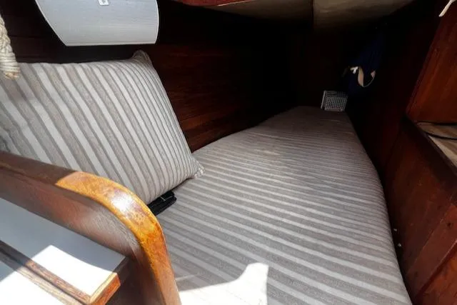Slide: The Image of Cozy cabin interior of 1980 CAL 39 MK II Sloop with striped bedding. - 23