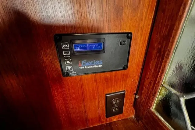 Slide: The Image of Tank systems monitor on 1980 CAL 39 MK II Sloop, wooden interior panel. - 30