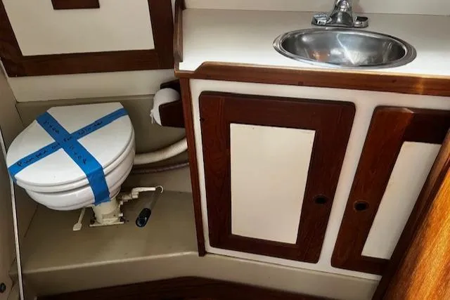 Slide: The Image of 1980 CAL 39 MK II Sloop bathroom with sink and taped toilet. - 32