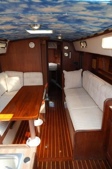 Slide: The Image of Interior of 1980 CAL 39 MK II Sloop with wood finish and striped seating. - 4