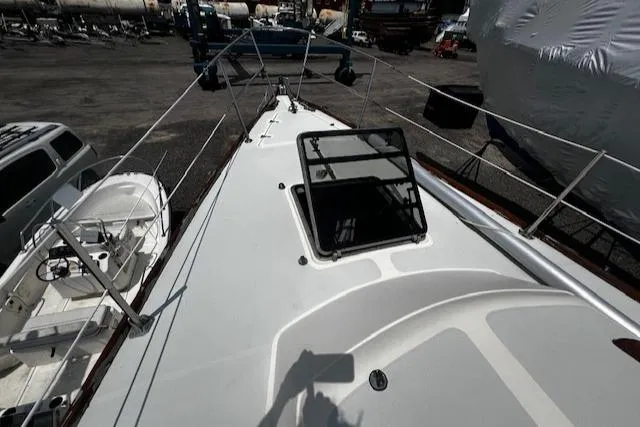 Slide: The Image of 1980 CAL 39 MK II Sloop deck view with open hatch in a boatyard. - 41