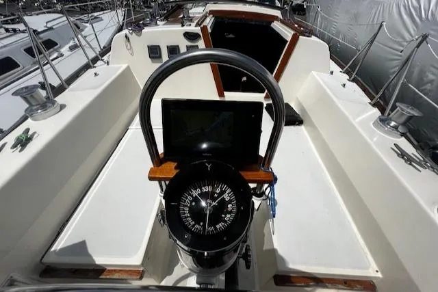Slide: The Image of 1980 CAL 39 MK II Sloop cockpit with compass and navigation equipment. - 46