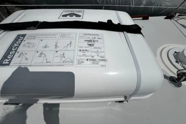 Slide: The Image of Life raft container on 1980 CAL 39 MK II Sloop deck, featuring RescYou instructions. - 48