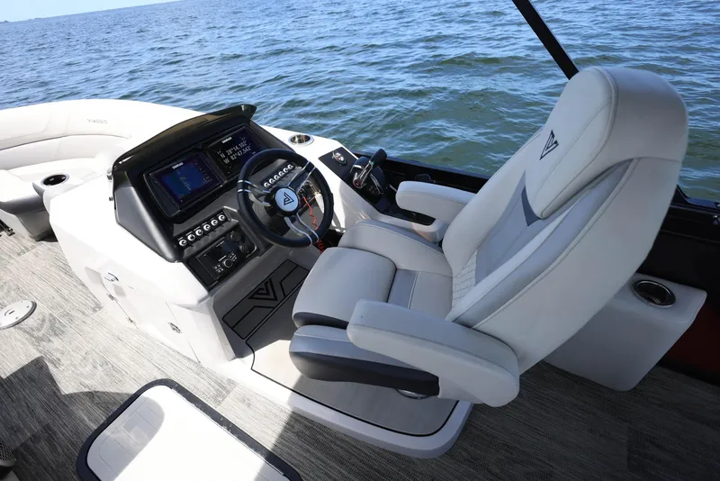 Slide: The Image of 2023 Viaggio DIAMANTE 23S boat interior with captain's chair and control panel on open water. - 10