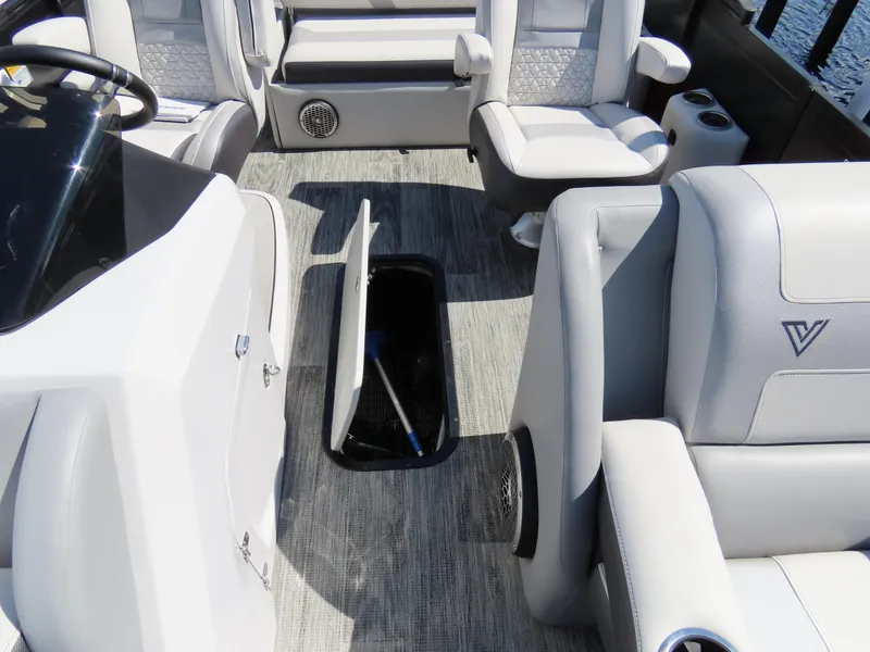 Slide: The Image of 2023 Viaggio DIAMANTE 23S boat interior with open storage compartment and luxurious seating. - 21