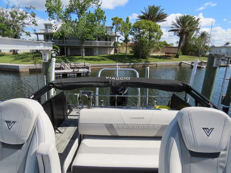 Slide: The Image of 2023 Viaggio DIAMANTE 23S boat interior with luxurious seating and waterfront view. - 24