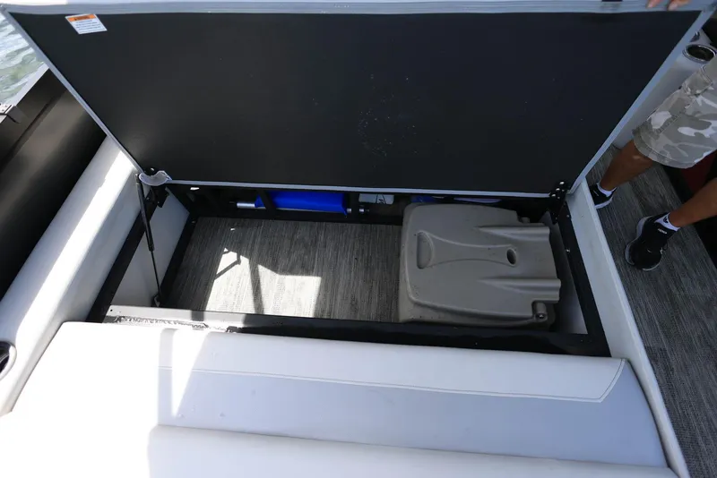 Slide: The Image of Open storage compartment in 2023 Viaggio DIAMANTE 23S boat, revealing interior space. - 26