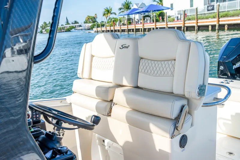 Slide: The Image of Luxurious seating on 2026 Scout 288 LXF boat, featuring elegant design and waterfront view. - 14