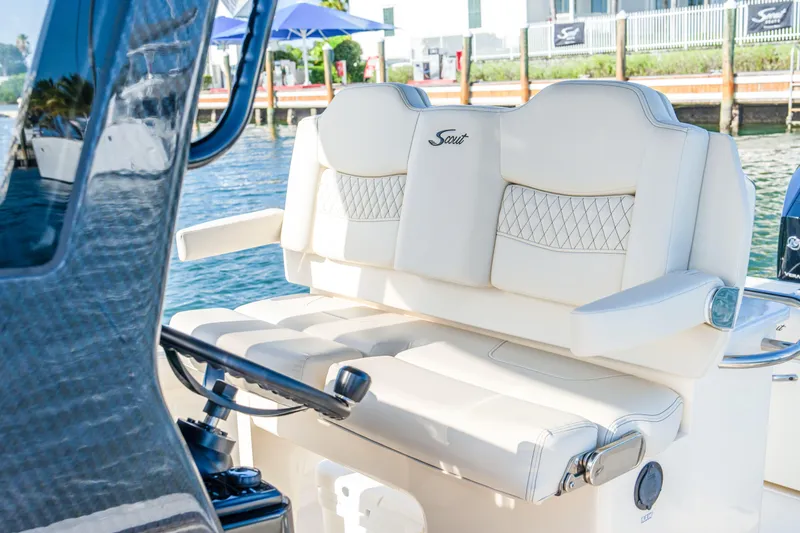 Slide: The Image of 2026 Scout 288 LXF boat interior with luxurious seating and steering wheel. - 15
