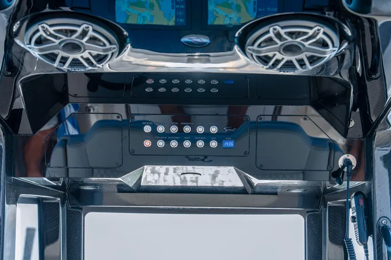 Slide: The Image of Control panel of 2026 Scout 288 LXF boat with speakers and digital displays. - 18