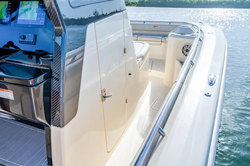 Slide: The Image of 2026 Scout 288 LXF boat interior with sleek design and advanced navigation system. - 21