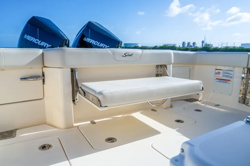 Slide: The Image of 2026 Scout 288 LXF boat interior with foldable seat and Mercury engines. - 30