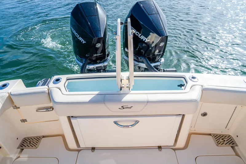 Slide: The Image of 2026 Scout 288 LXF boat with dual Mercury engines on water. - 32