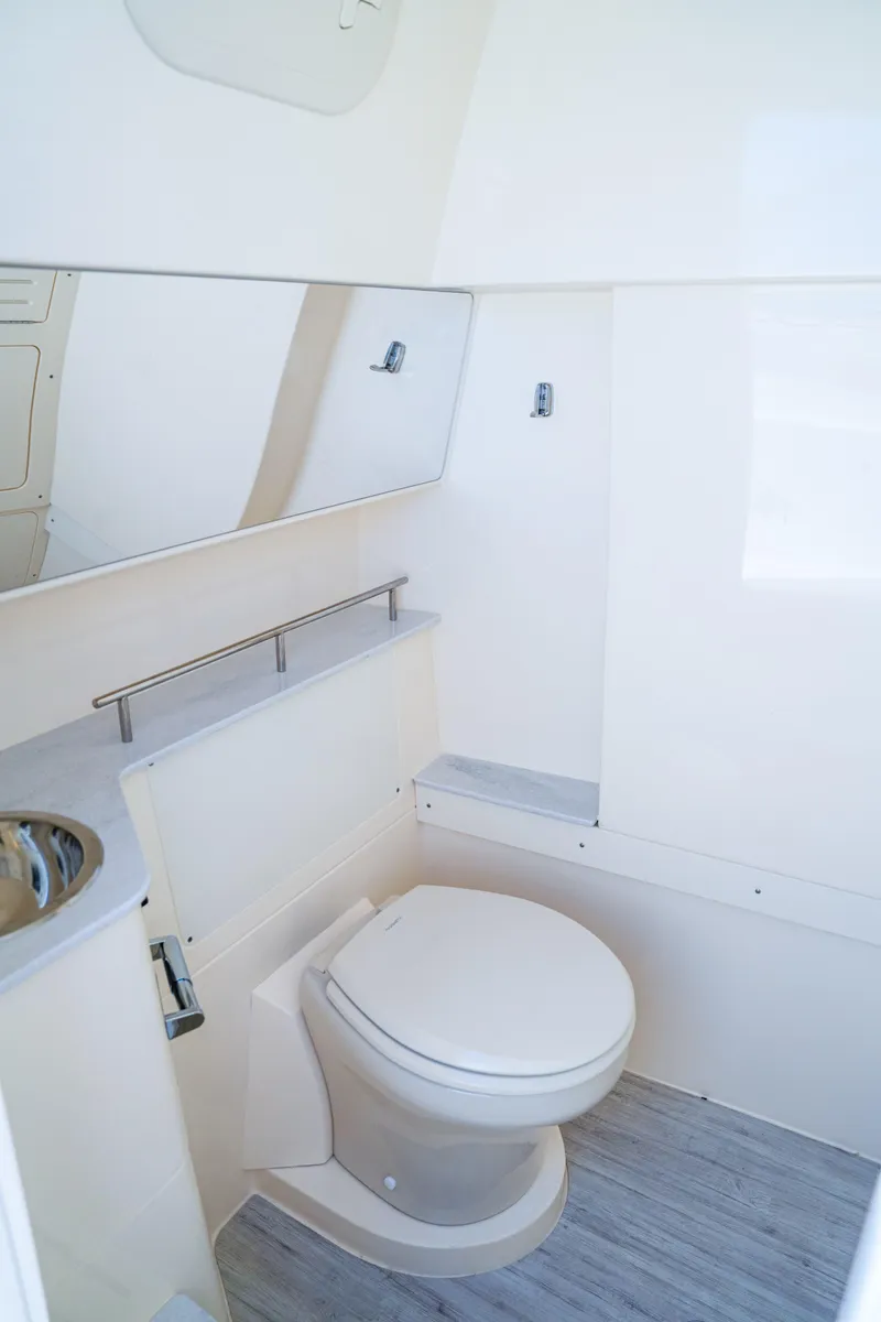 Slide: The Image of 2026 Scout 288 LXF boat interior bathroom with modern fixtures and sleek design. - 36