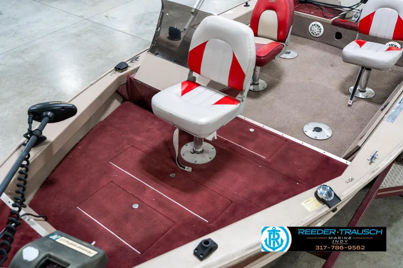 Slide: The Image of 1997 Lund 1700 Pro Angler boat interior with red and white seating. - 11