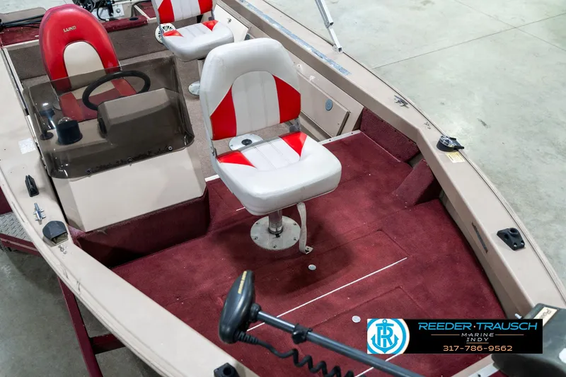 Slide: The Image of 1997 Lund 1700 Pro Angler boat interior with red and white seating. - 12