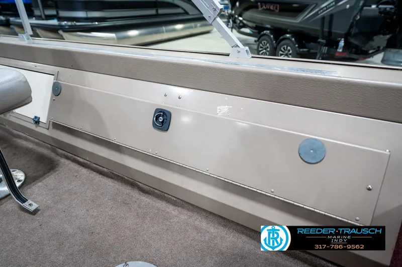 Slide: The Image of 1997 Lund 1700 Pro Angler interior detail with storage compartment and seat. - 26