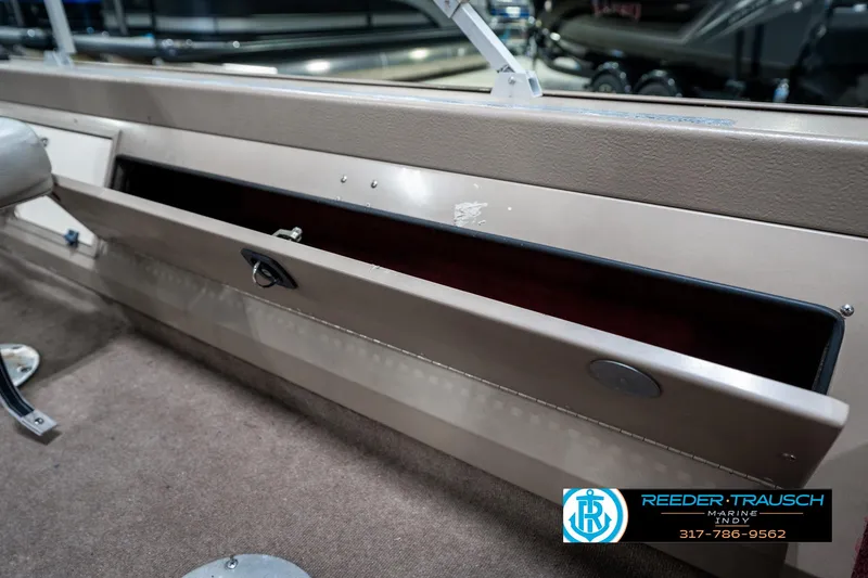 Slide: The Image of 1997 Lund 1700 Pro Angler boat storage compartment, open with visible interior. - 27