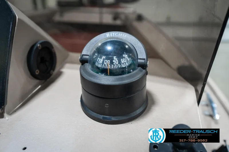 Slide: The Image of Compass on 1997 Lund 1700 Pro Angler boat dashboard, featuring Ritchie navigation. - 34