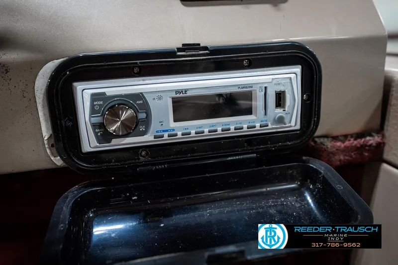 Slide: The Image of Pyle marine stereo in a 1997 Lund 1700 Pro Angler boat dashboard. - 35