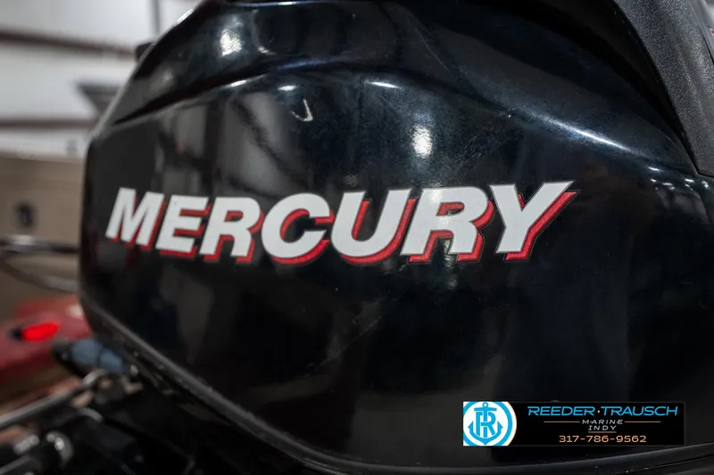 Slide: The Image of Close-up of a Mercury outboard motor on a 1997 Lund 1700 Pro Angler boat. - 43