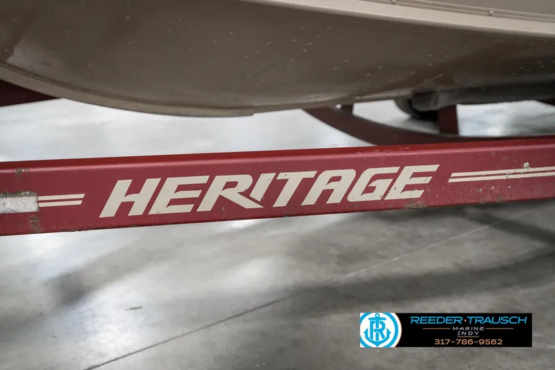 Slide: The Image of Red Heritage boat trailer for 1997 Lund 1700 Pro Angler, displayed indoors. - 46