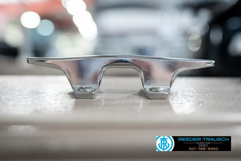 Slide: The Image of Close-up of a metal cleat on a 1997 Lund 1700 Pro Angler boat. - 49