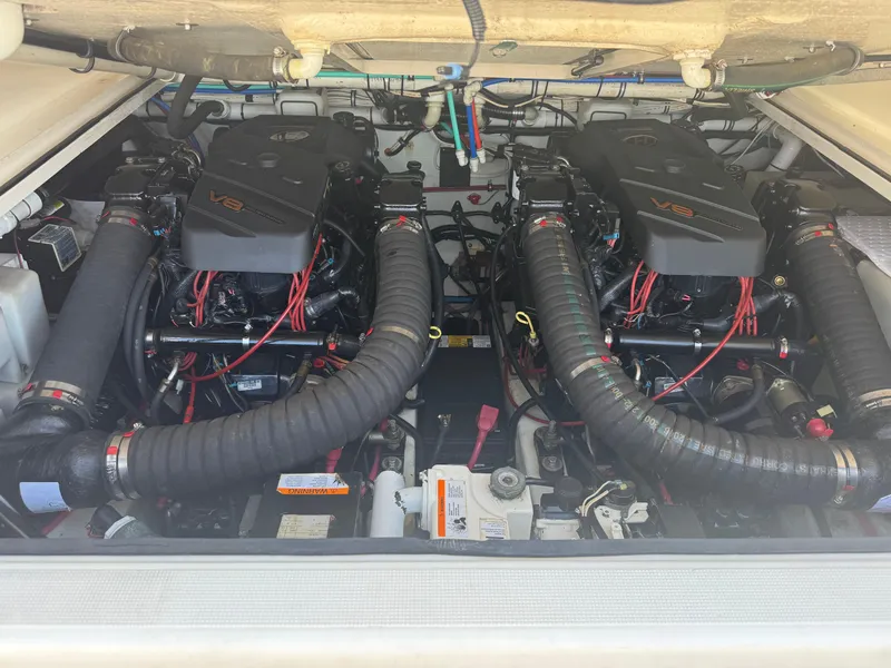 Slide: The Image of Engine compartment of a 2002 Pursuit 3000 Express boat with dual V8 engines. - 26
