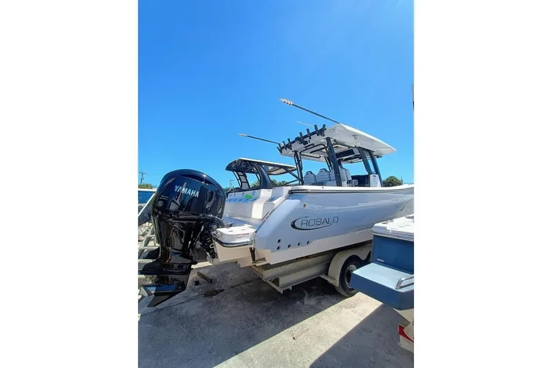 Slide: The Image of 2025 Robalo R300 Center Console boat with Yamaha engine, parked on trailer. - 8